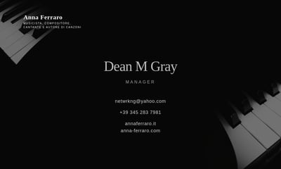 A black business card with white text for a musician and manager, framed by black and white piano keys in the corners.